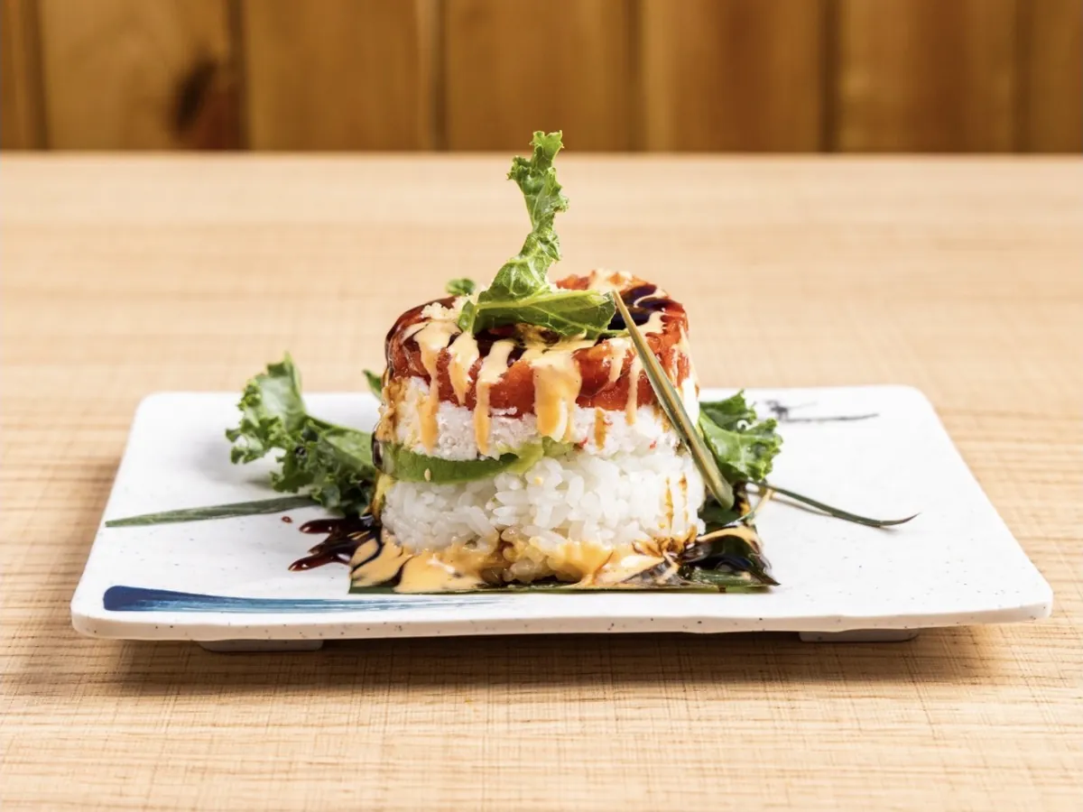 Spicy tuna tower layered over avocado and sushi rice, finished with spicy mayo and eel sauce